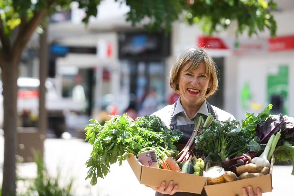FRESH: Slow Food Hunter Valley co-leader Helen Hughes with the mystery boxes of ingredients shoppers will use in the cooking competition. Picture: Jonathan Carroll