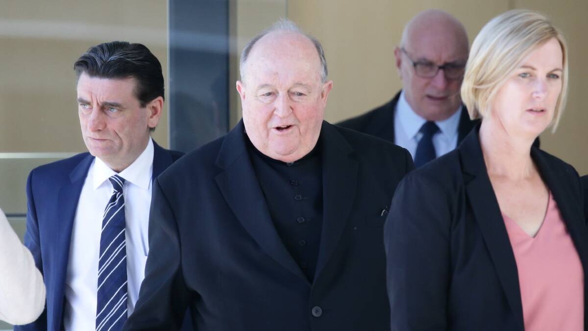 Philip Wilson (centre) leaves court last week. Picture: Jonathan Carroll