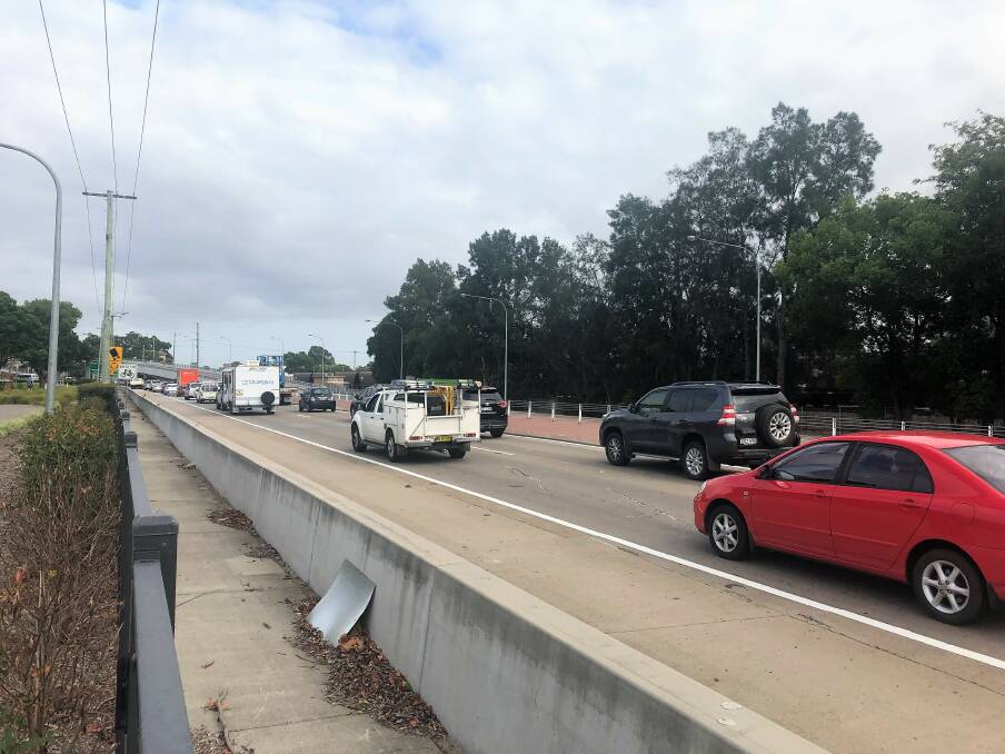CRAWL: The traffic trying to get onto the New England Highway roundabout at Maitland Train Station at 9am on Monday.