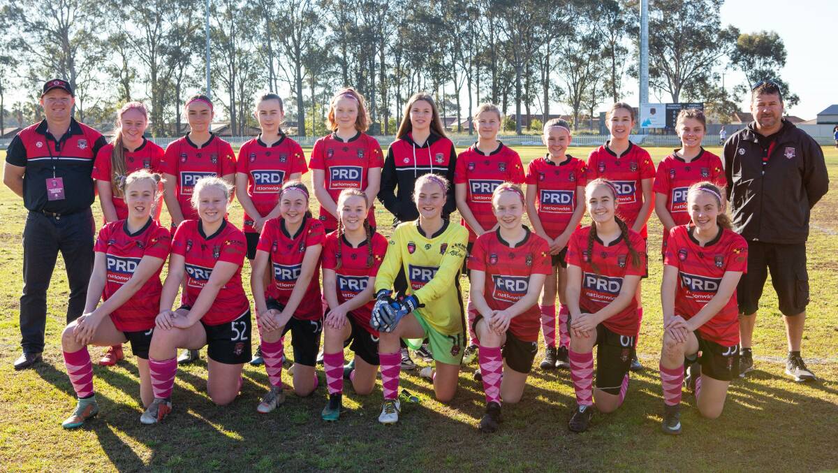 SUPPORT: Thornton Redbacks Football Club's under-14s girls side in their pink socks in support of the Hunter Breast Cancer Foundation on Sunday. More pictures page 15.