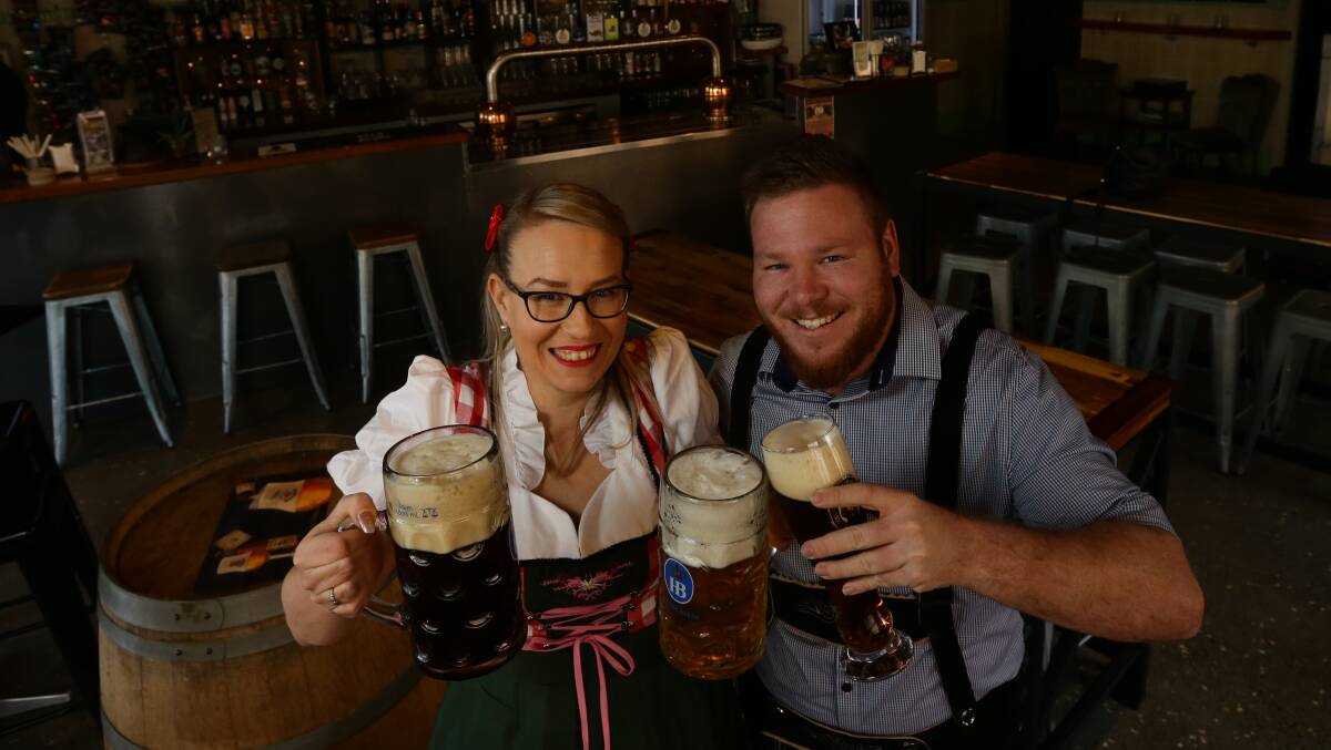 The Pourhouse's Jesilee Rigg and Matt Robards in German attire ahead of Oktoberfest next month. Picture: Jonathan Carroll