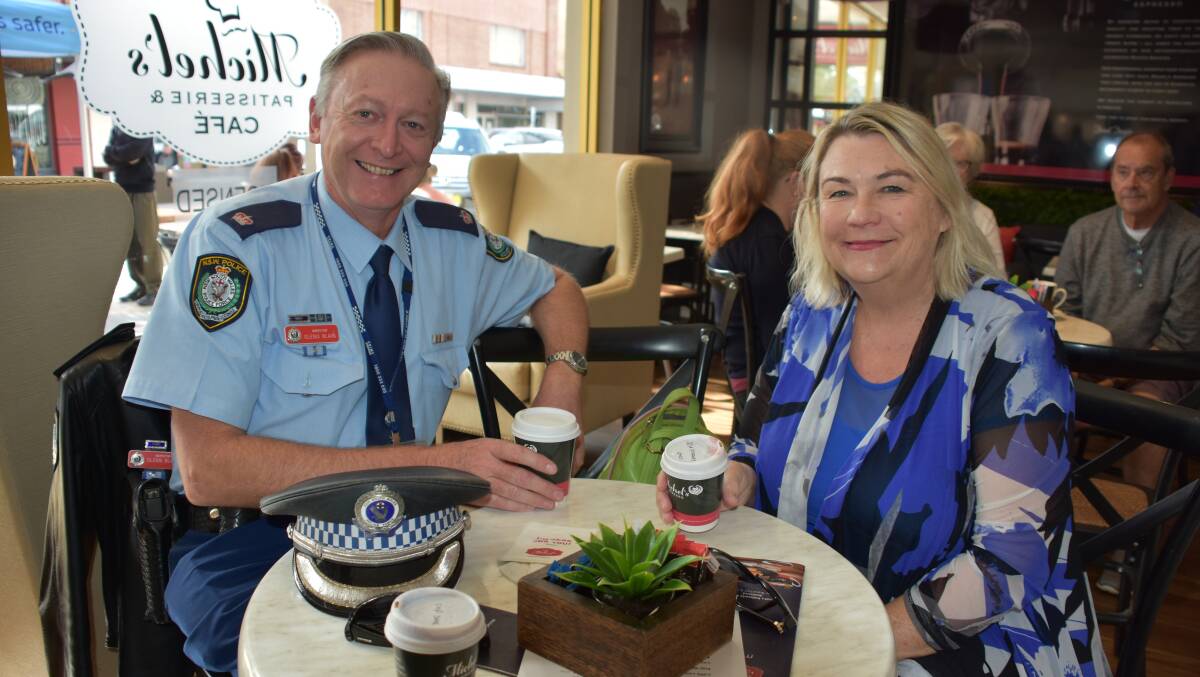 CHAT: Maitland police officer in charge Chief Inspector Glenn Blain and Ashtonfield woman Caroline McTaggart at the Coffee with a Cop event at Michel's Patisserie.