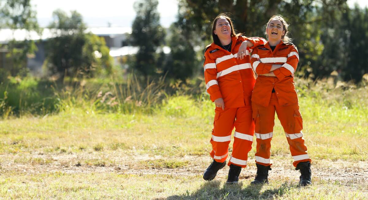 VOLUNTEERS: Maitland SES members Sarah Thomson and Alex Varley ahead of the annual Wear Orange Wednesday. Picture: Jonathan Carroll