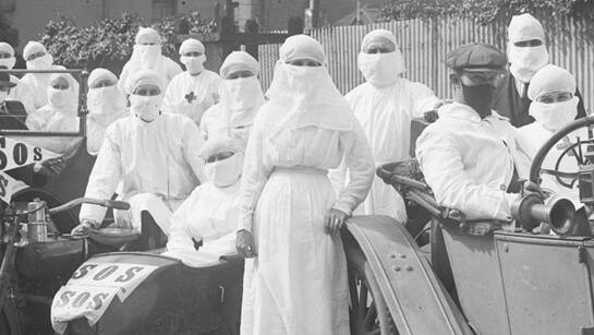 HEALTH: Workers wearing masks at the Riley Street Depot at Surry Hills during the height of the influenza pandemic in April 1919. Picture: NSW State Archives and Records