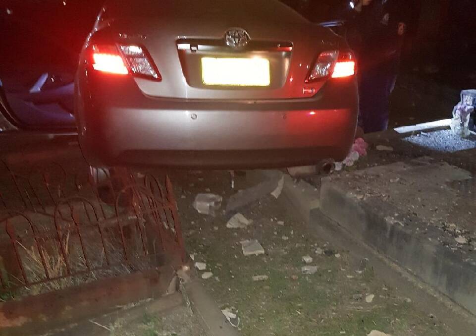 SCENE: The Toyota Camry was abandoned in Campbells Hill Cemetery at Telarah. Picture: NSW Police