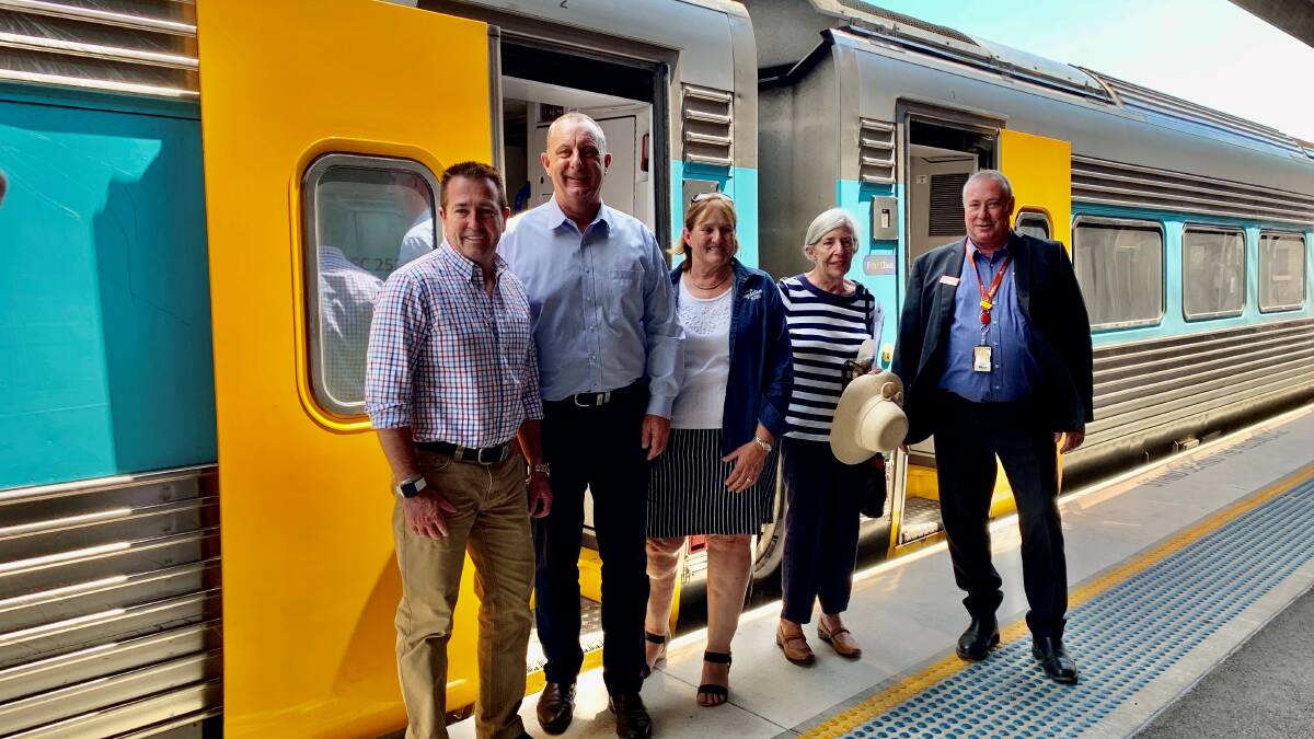 ALL ABOARD: Minister Paul Toole, Upper Hunter MP Michael Johnsen, Mayor of Singleton Sue Moore, Anne from Two More Trains for Singleton and NSW TrainLink Robert Blanch.
