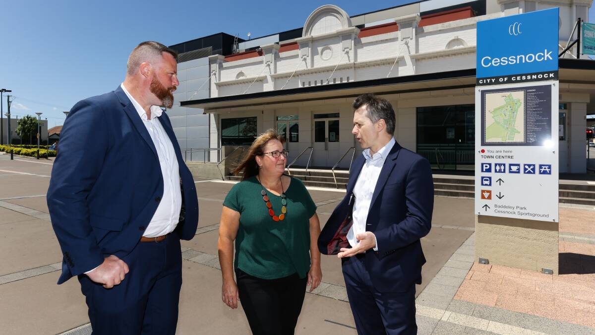 VISIT: Shadow Minister for Housing and Homelessness Jason Clare and Labor candidate for Hunter Dan Repacholi speak with Hunter Tenants Advice and Advocacy Service coordinator Nicole Grgas. Picture: Jonathan Carroll
