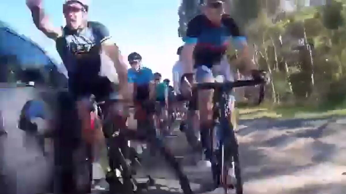 Police are investigating the moment a group of cyclists were struck by a passing car