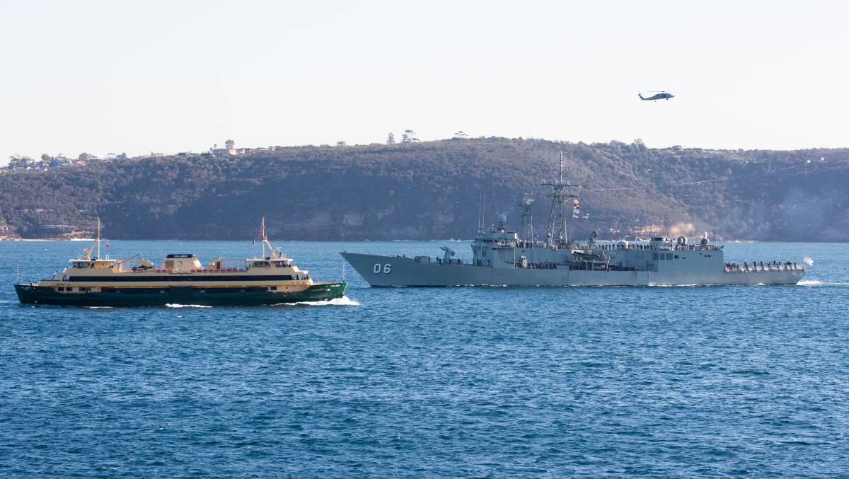 LAST STOP: HMAS Newcastle cruises through Sydney Harbour on the way to Garden Island on Friday morning. Picture: Janie Barrett