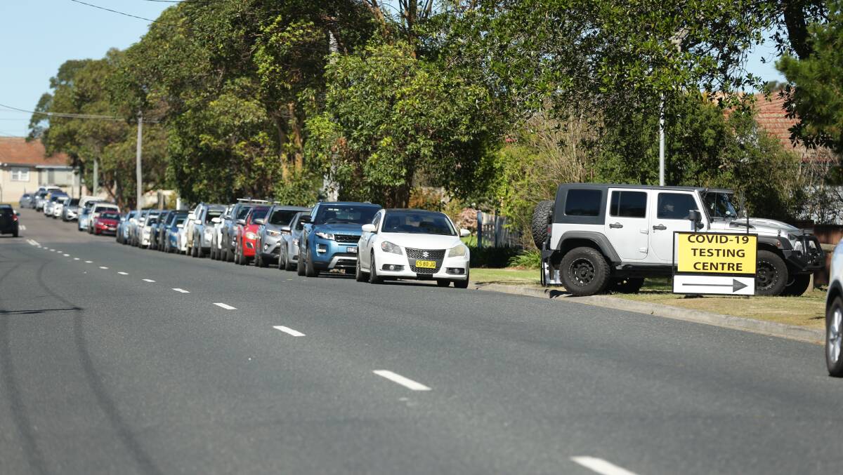 DELAYS: The queue at the East Maitland testing clinic on Thursday morning.