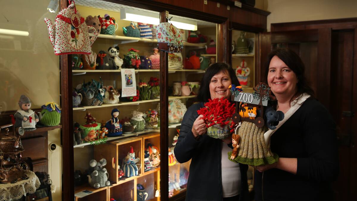 TEA TIME: Sue Jarrett and Kylie Richards both of Campbell's Store preparing for the 30th and final Morpeth Tea Pot and Tea Cosy exhibition. Picture: Marina Neil.