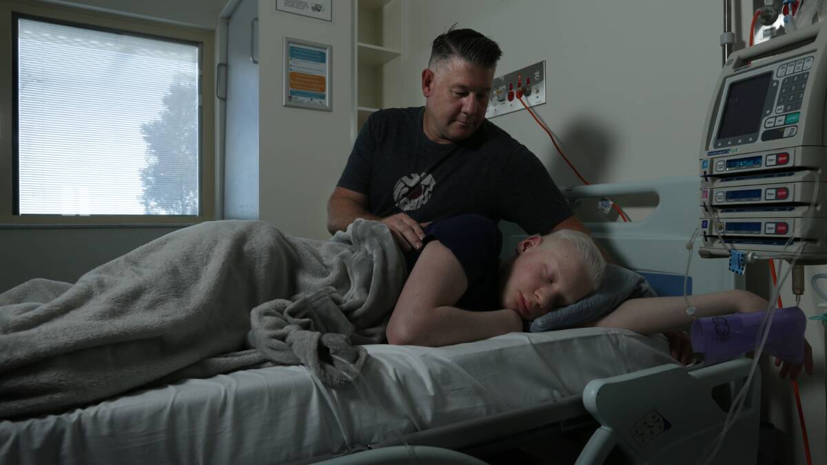 HOPE: Johey Basedow pictured with his dad Scott in John Hunter Hospital this week. PICTURE: Simone De Peak. 