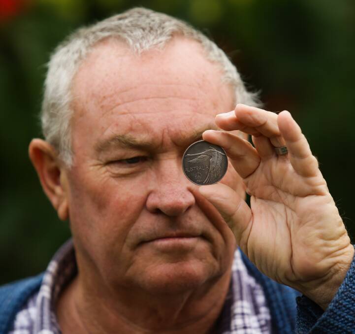 UNDER THE HAMMER: Maitland and District Coin Club member Steve Schumacher pictured with the rare Goose Dollar. Picture: Jonathan Carroll.