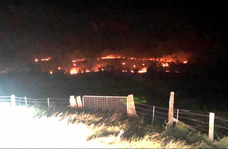 LAND LOST: The Mindaribba fire on Eelah Road which was contained early Tuesday morning. PICTURE: Lower Hunter Rural Fire Service.