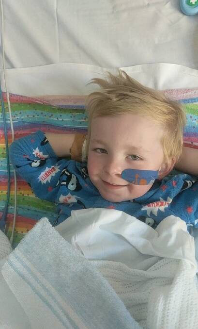 ALL SMILES: Marcus was up and about and could manage a smile a few days after his open heart surgery.