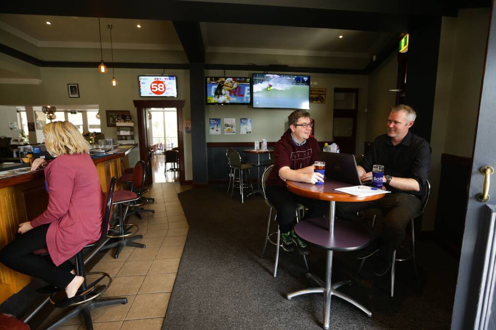 GOOD RETURNS: Alex Mehan, left, with accountant/financial adviser Rob Auer at The Family Hotel Maitland. Picture: Jonathan Carroll.