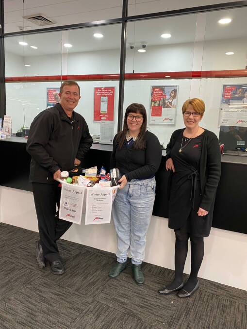 WARMING: The Mutual Bank's Business Banking Manager Errol Russell, Member Service Supervisor Sandra Webber with Maitland Neighbourhood Centre Manager Sarah Adams (centre) receiving a basket of goods from the Maitland branch. PICTURE: Supplied.