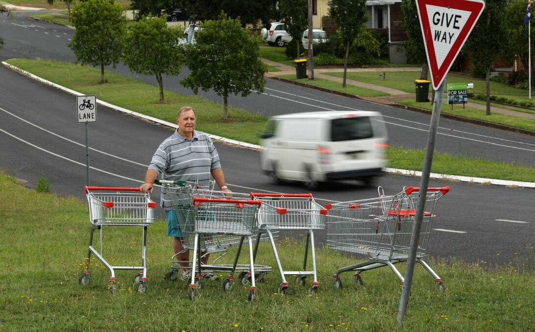 WHEELY?: Cr Henry Meskauskas pictured with feral shopping trolleys on the corner of Vindin Street and Alexandra Avenue, Rutherford. PICTURE: Jonathan Carroll.