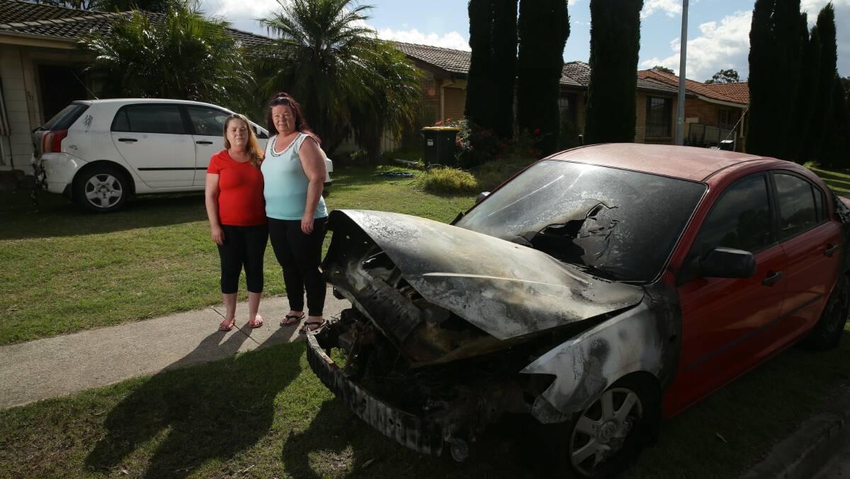 HELP IS AT HAND: Sisters Kathryn Blakemore and Linda Carter with the damaged cars. PICTURE: Jonathan Carroll.