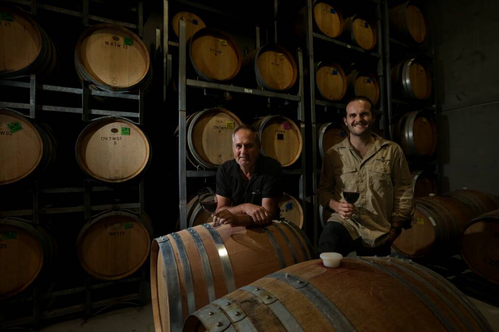 A TOAST: Keith Tulloch (left) and son Alisdair toasting their carbon neutral certification at Keith Tulloch Wine this week. PICTURE: Simone De Peak.