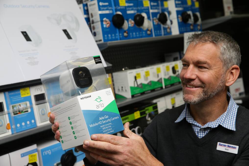 CANDID CAMERA: Nick Swanson from Harvey Norman Rutherford has reported a big increase in the sale of home security systems. PICTURE: Jonathan Carroll.