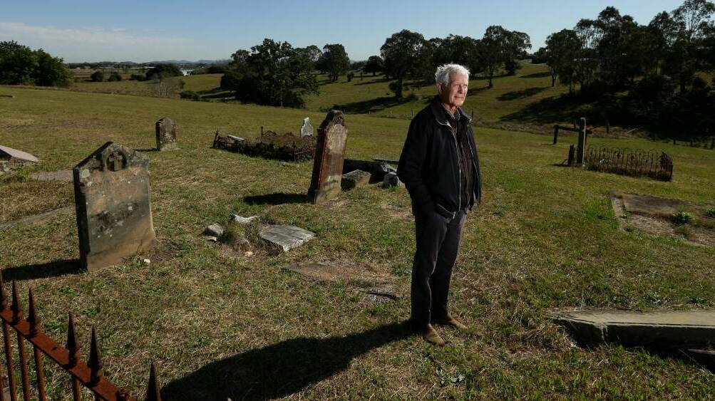 STEEPED IN HISTORY: David Daines stands in East Maitland's historic Glebe cemetery. PICTURE: Jonathan Carroll.