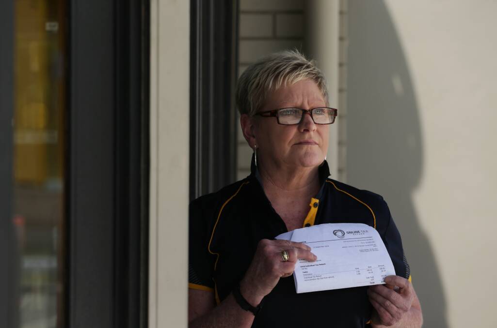 TAXED: Kerrie Redgrove of Rutherford is warning people of the dangers of lodging their tax return online. Picture: Simone De Peak.