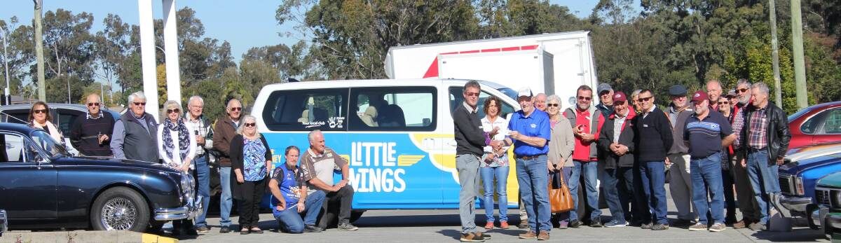 FLYING HIGH: Community representatives gather to present Michael See of Little Wings with a recent donation. PICTURE: Supplied.
