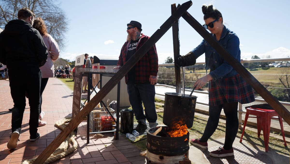 ROASTED: Bree Hakes and her partner Dave Bean from The Cabin Collective roast coffee beans over an open fire during the Aroma Festival. PICTURE: Max Mason-Hubers.
