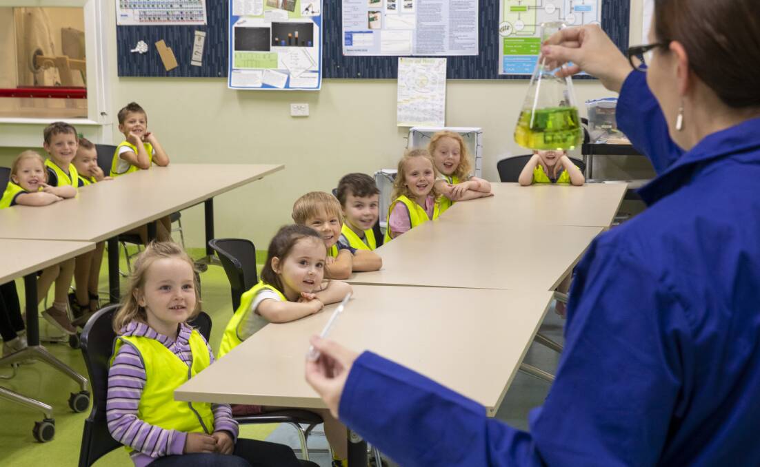 ALL EARS: The group of children from St Nick's Early Education Centre, Lochinvar in the lab with St Joseph's science teacher Jess Brunton. PHOTO: Supplied