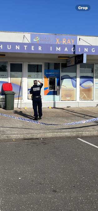 Police at the Rutherford ATM scene on Tuesday morning.