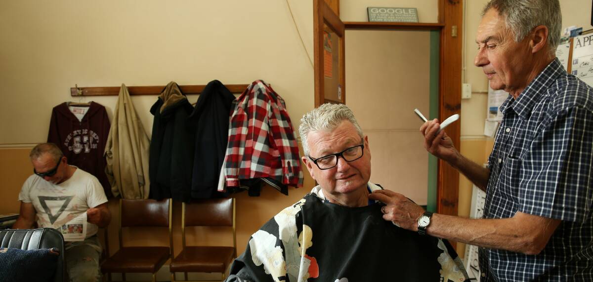 SLASH: New Tattersalls Hotel licensee Mick Finch ready for a close shave with barber Grant Carter. PICTURE: Max Mason-Hubers.