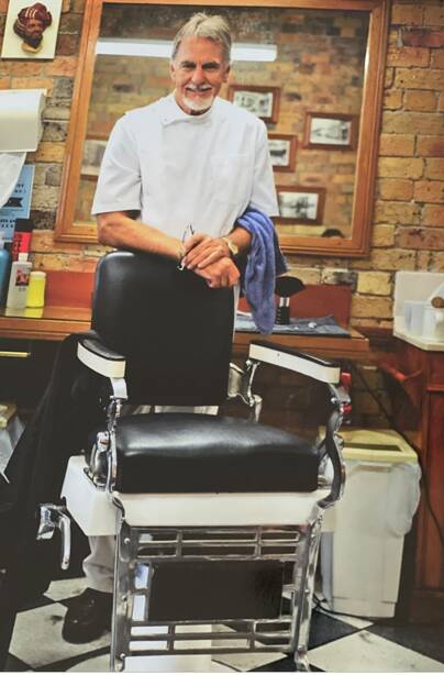 Leigh pictured at his barber shop in High Street, Maitland. Picture supplied.