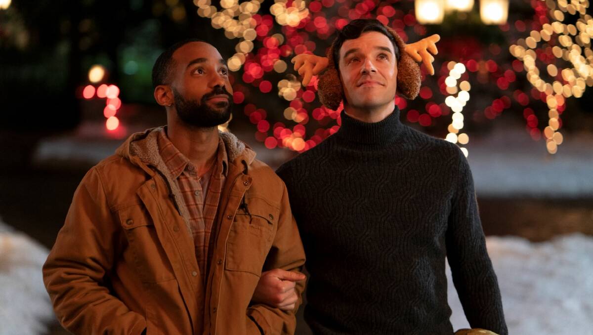  Philemon Chambers, left, and Michael Urie in Single All The Way. Picture: Philippe Bosse/Netflix 