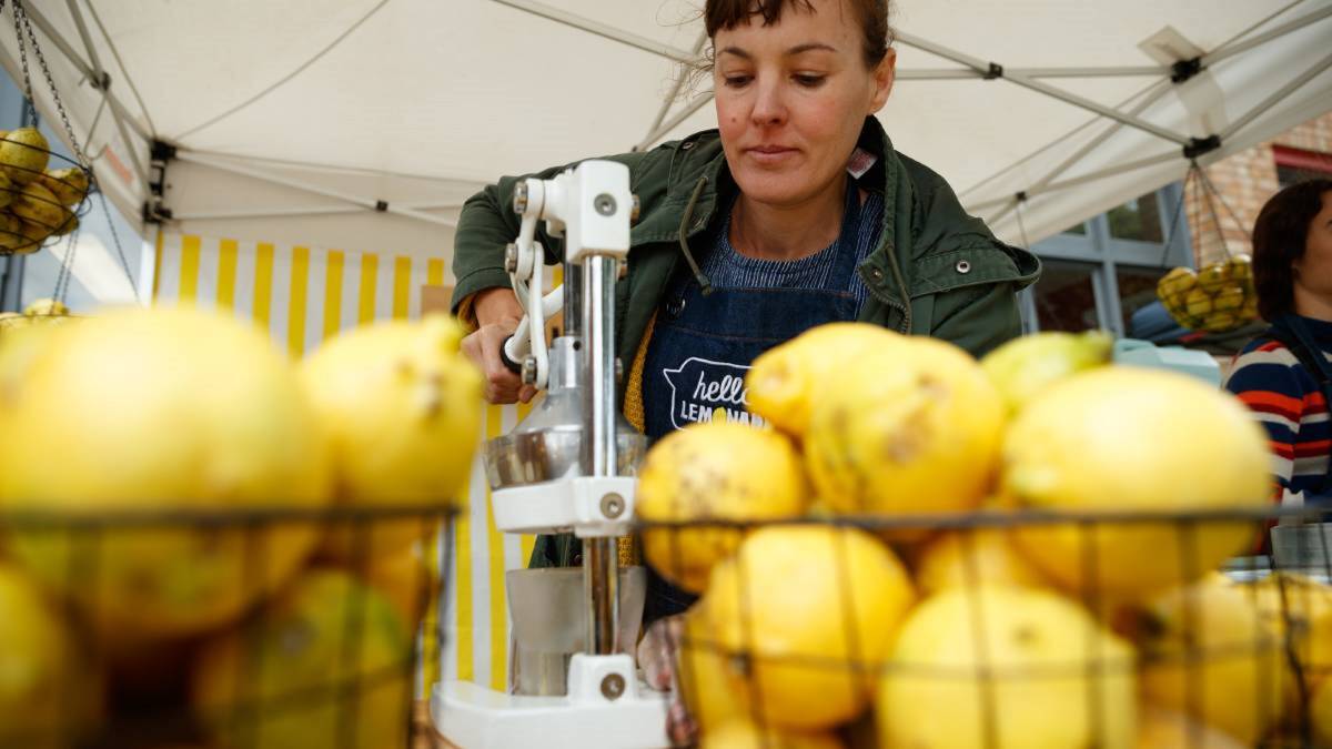 OLIVE TREE MARKET: A stallholder prepares lemonade at the event. The market is back in Maitland on Saturday.