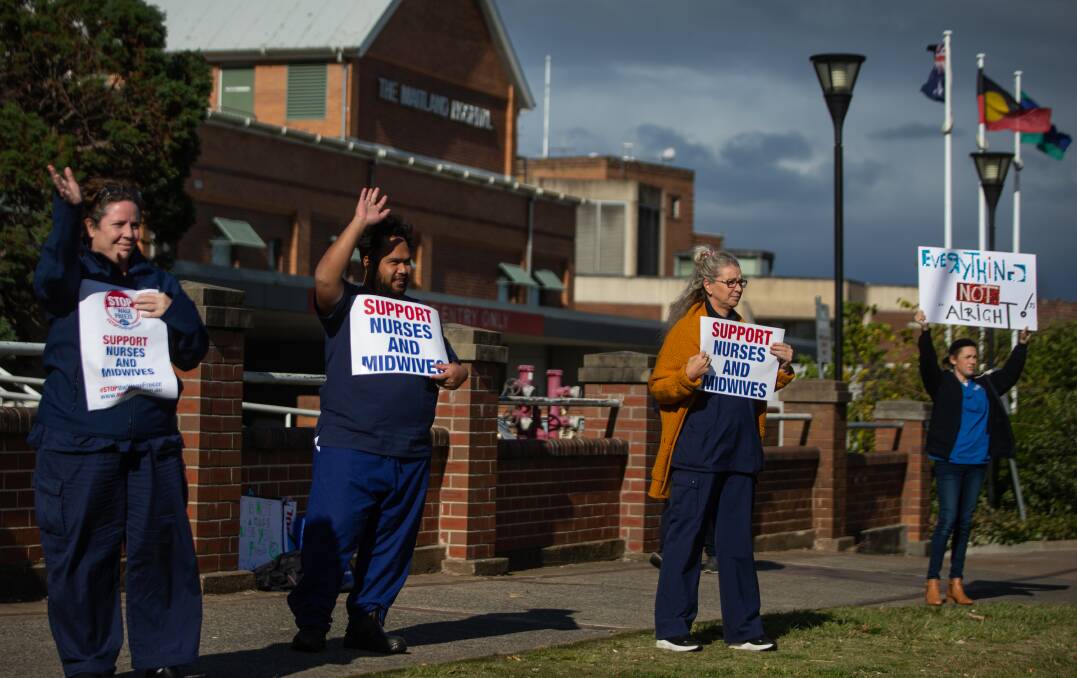 SOCIAL DISTANCE PROTEST: Nurses and midwives at Maitland Hospital express their displeasure at the Premier's wage freeze plans. Picture MARINA NEIL.