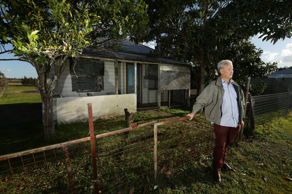 BATTLE: Chris Richards from Maitland Heritage Guardians pictured outside the cottage he wants saved from demolition. Picture: Jonathan Carroll.