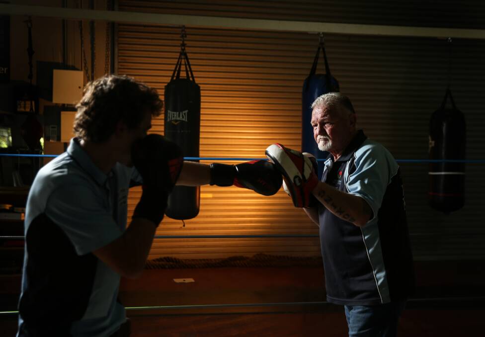 GOING STRONG: After decades in the game, trainer Neville Short still loves working with young boxers such as the highly talented Jake Collins-Doherty.  Picture Marina Neil. 