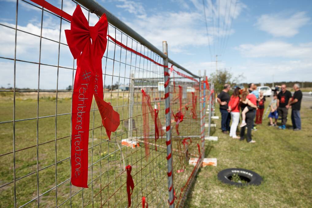 SEEING RED: Red protest ribbons at Williamtown on the second anniversary of the PFAS contamination.