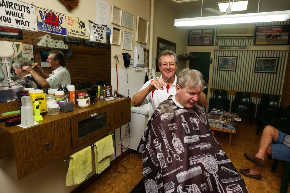 HE'S A WHIZ: John (Whizzer) Quinton giving a customer a trim up at his Rutherford salon. Whizzer is celebrating 50 years in the trade this month.