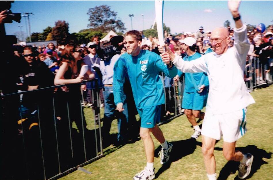 FLASHBACK: David and running mate Clinton Modinger bring the torch into Maitland Park.