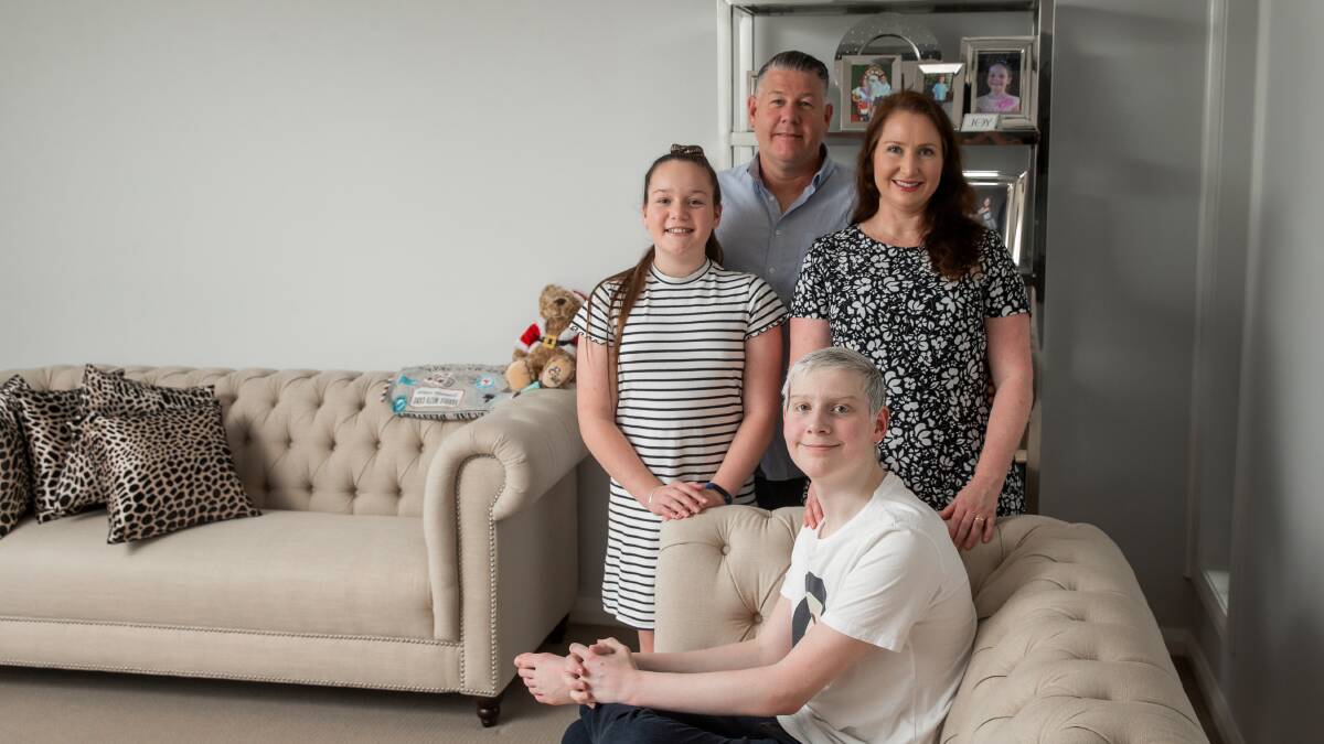 JANUARY 2020: Johey at home with his mum Emma, dad Scott and sister Isabella. 