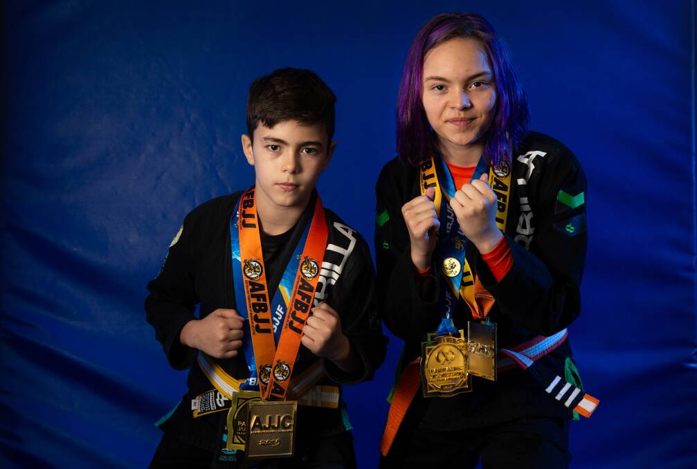 DANGEROUS DUO: Casey and Madison Clarke whose first year of competition fighting has led to a swag of medals. Picture Marina Neil