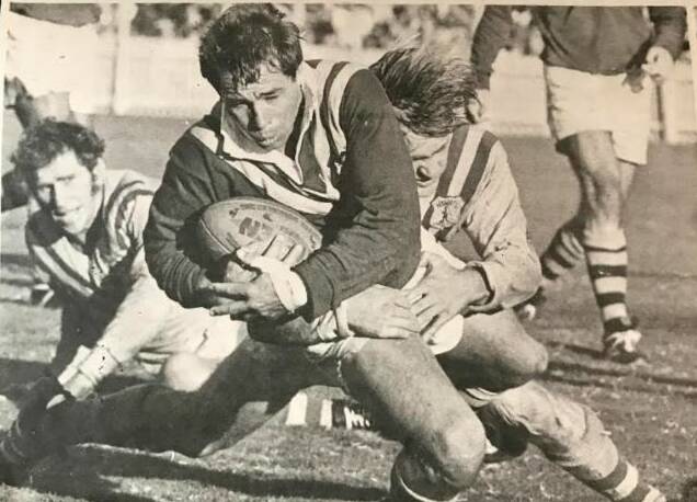 FLASHBACK: Brian Burke tackled by Tommy Raudonikis in City v Country. That's former Maitland captain-coach Gary Sullivan in the background, playing for City.