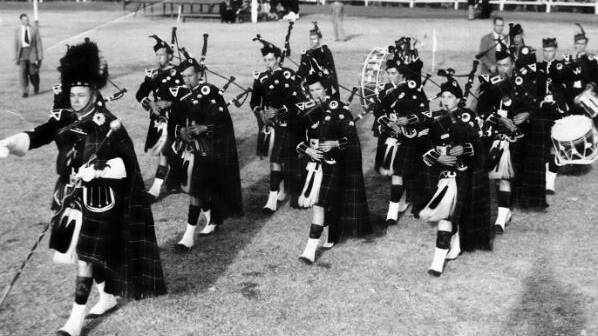 The Maitland District Pipe Band at the Tamworth Highland Gathering, 1957, where it gained 3rd place in the A Grade Championship. Drum Major Ken Tucker, Pipe Major Don Johnson, Pipers Dick Graham, Nancy Graham, Ina Bennett, Bob Dewar, Nancy Grubb, Doug Lambert, Bob Griffiths. Drummers Roy Cheetham (base), Keith McLenan, Harley Longbottom, J Clarence.