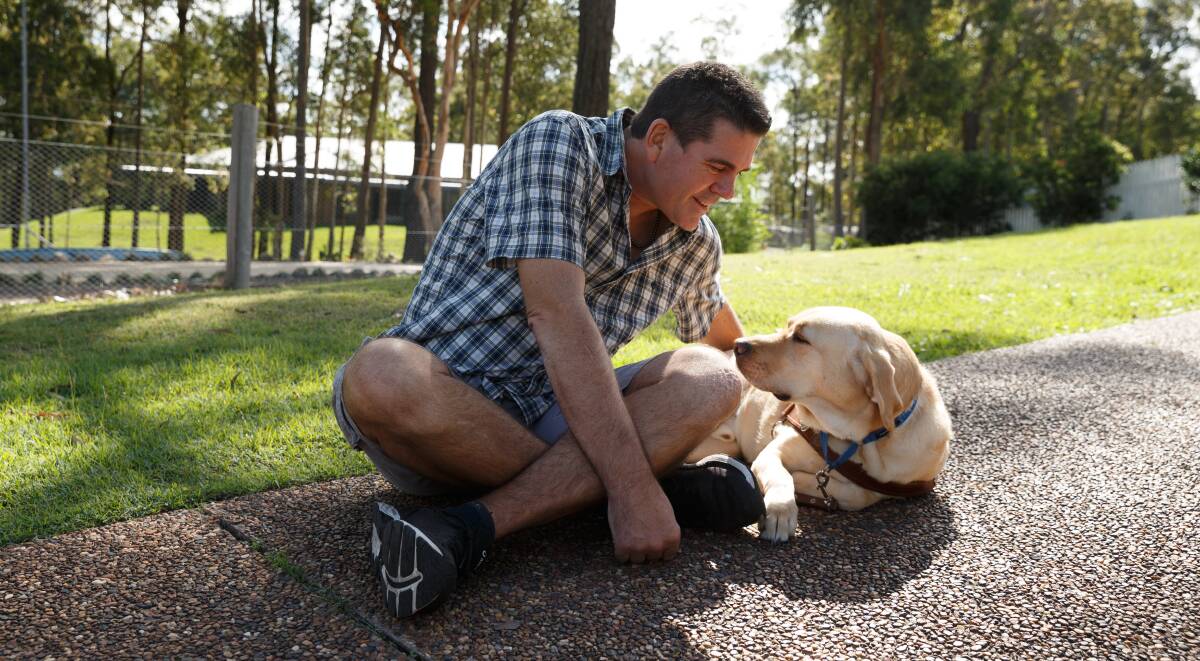 WINNING TEAM: Paul Johns with his beloved guide dog Keith. Picture Max Mason-Hubers.