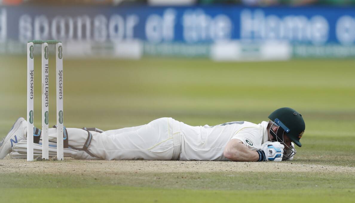 FLATTENED: Steve Smith was struck by a bouncer from Jofra Archer in the Second Test. Picture Alastair Grant AP.