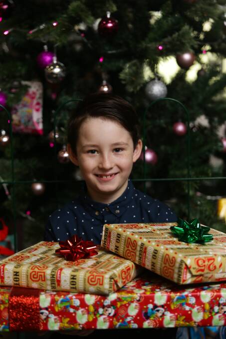 CHRISTMAS SPIRIT: Brayden Kennedy who will give his toys to less fortunate children. Picture: Jonathan Carroll.