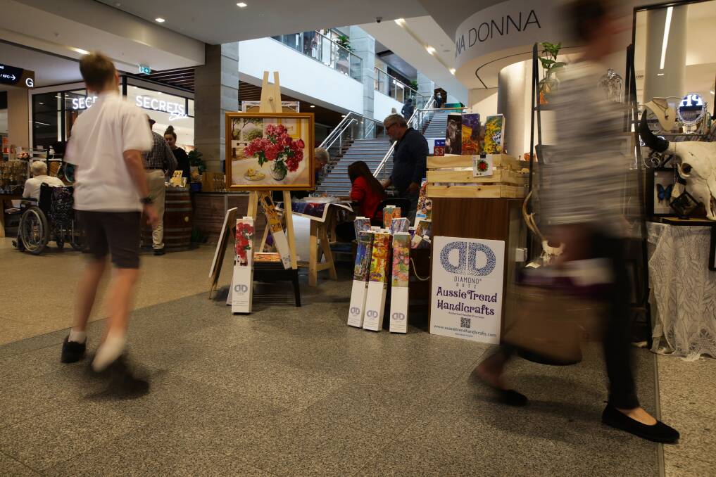 MARKET DAY: Shoppers enjoy some of the pop up winter market stalls at Stockland Green Hills during the June event.