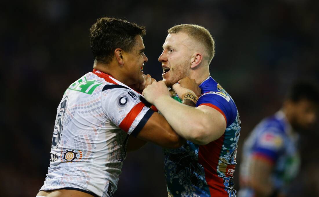 IN THE FIRING LINE: Latrell Mitchell, pictured left having a frank exchange with Knight Mitch Barnett, was in the centre of the furore this week. Picture Jonathan Carroll